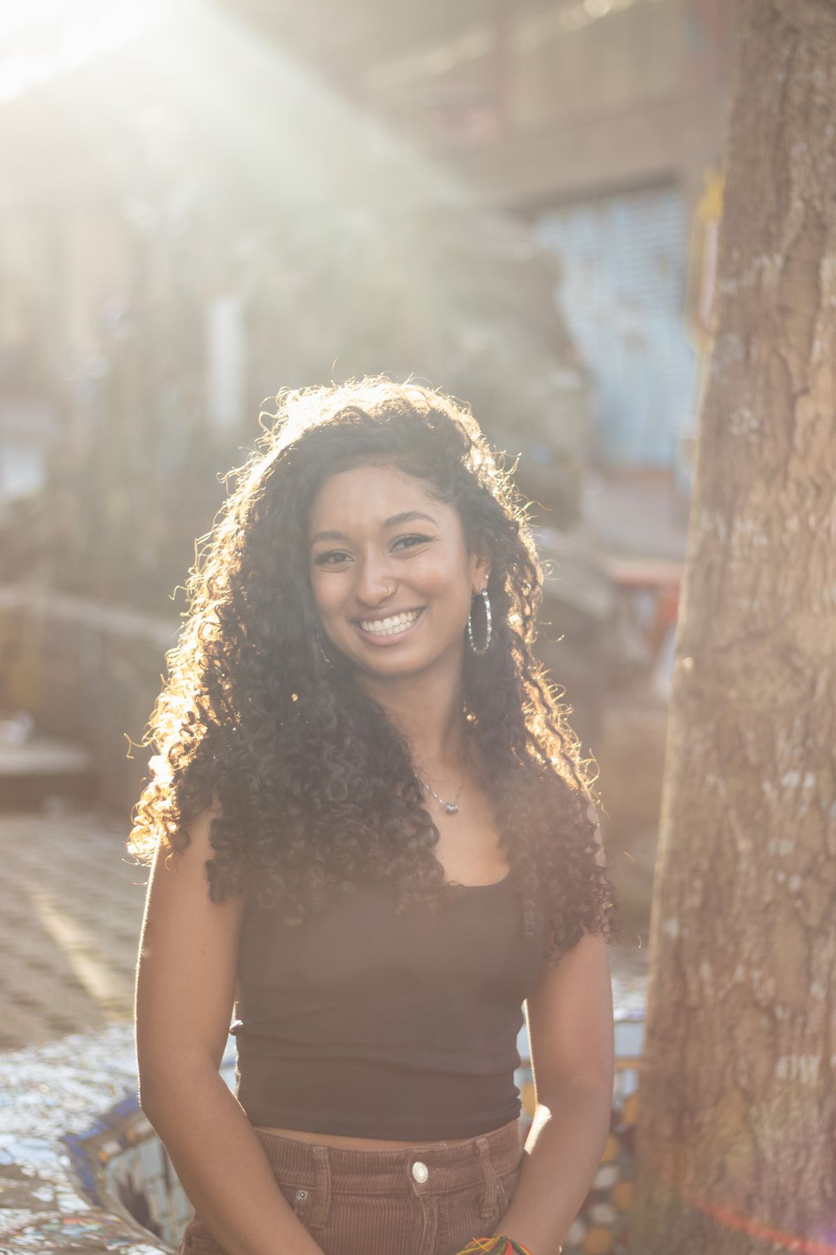 Young adult smiling, warm natural light