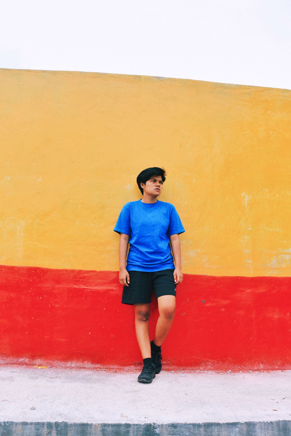 Teenager portrait against a colorful wall